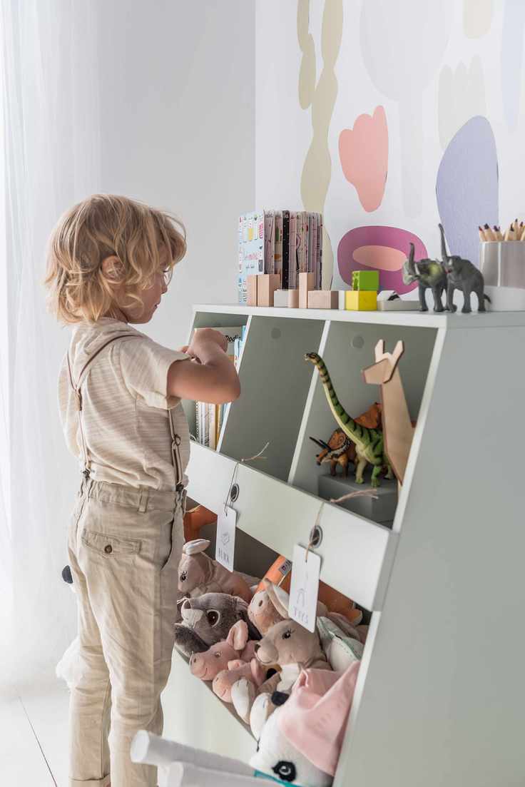 Playroom storage in open shelves with cuddly toys