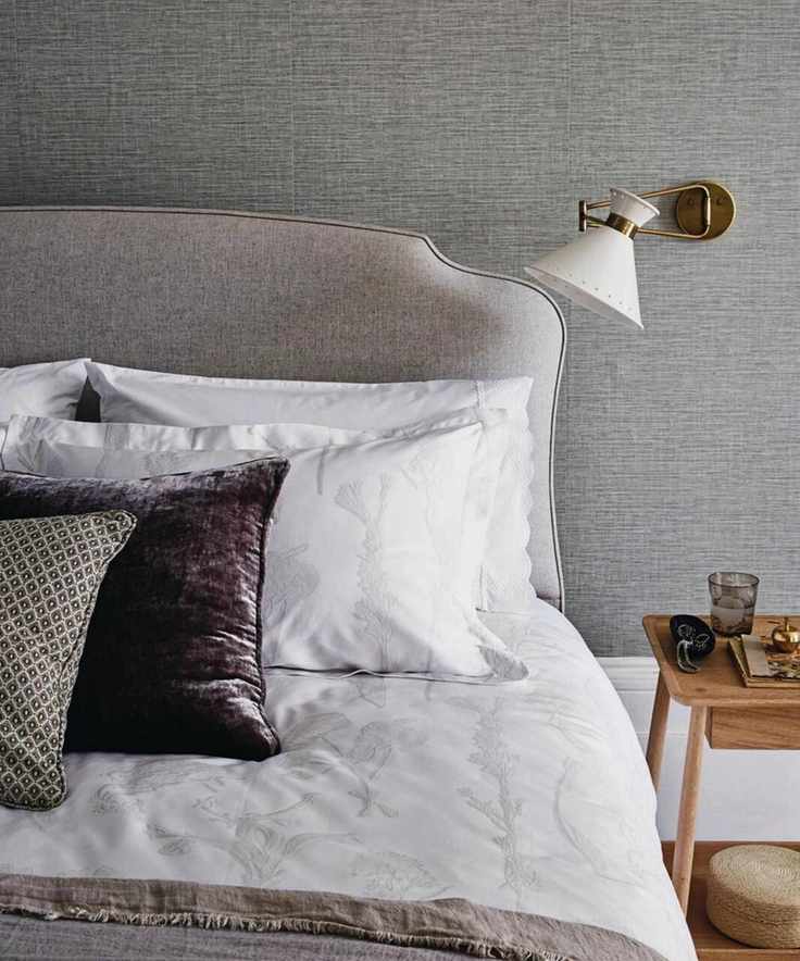 Stylish grey bedroom with mixed materials
