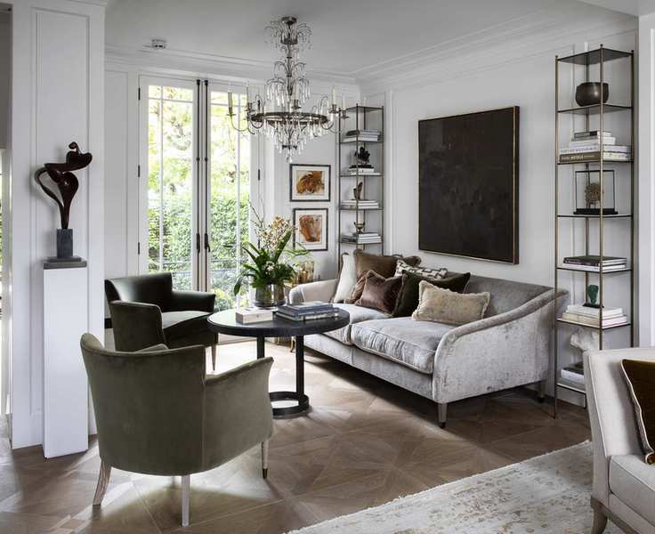 Contemporary white room with a traditional candle chandelier