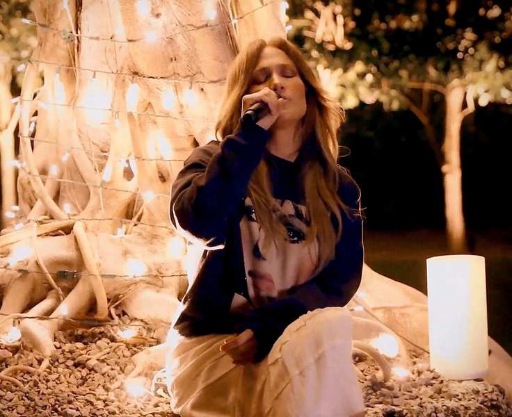 jennifer lopez against a tree background