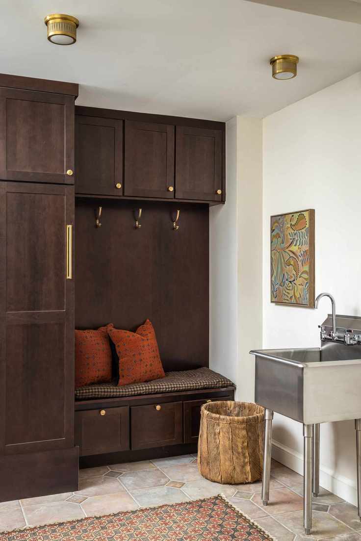 mudroom with stainless steel sink on legs