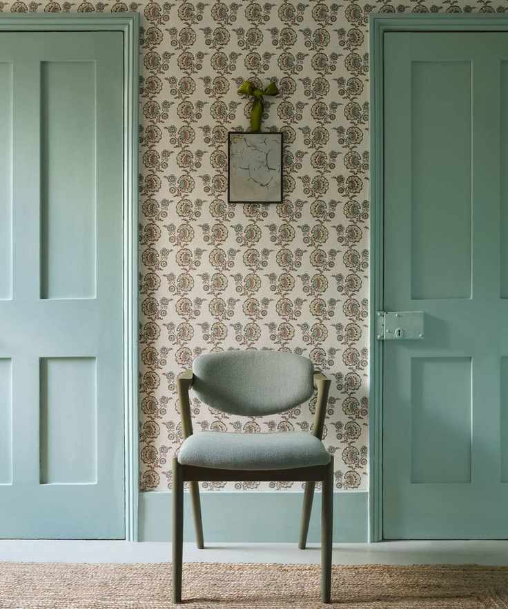 Hallway with floral wallpaper and blue accents
