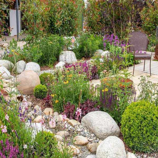 landscaping with rocks and plants in Mediterranean style garden