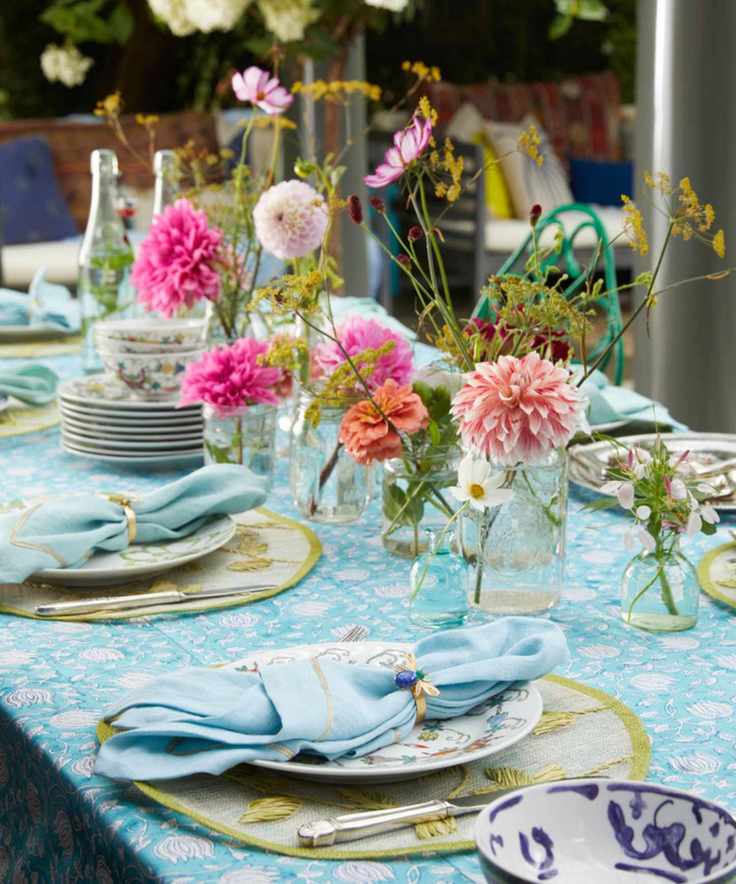 Spring tablescape with turquoise and pink color scheme and fresh flowers