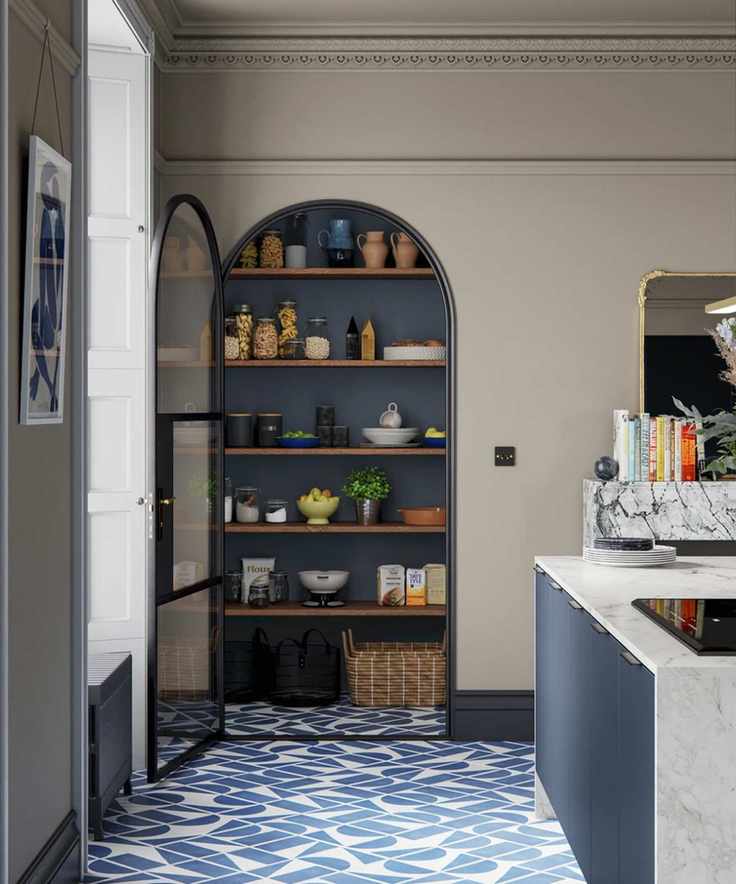 Modern kitchen with arch doorway leading to pantry, kitchen island