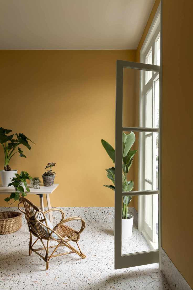 Yellow walls, textured stone floor