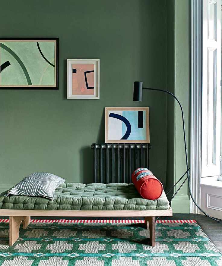 Daybed with natural materials in a green hallway