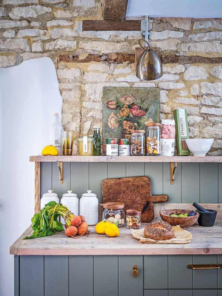 Pantry with grey tongue and groove panelling with exposed stone wall and beams