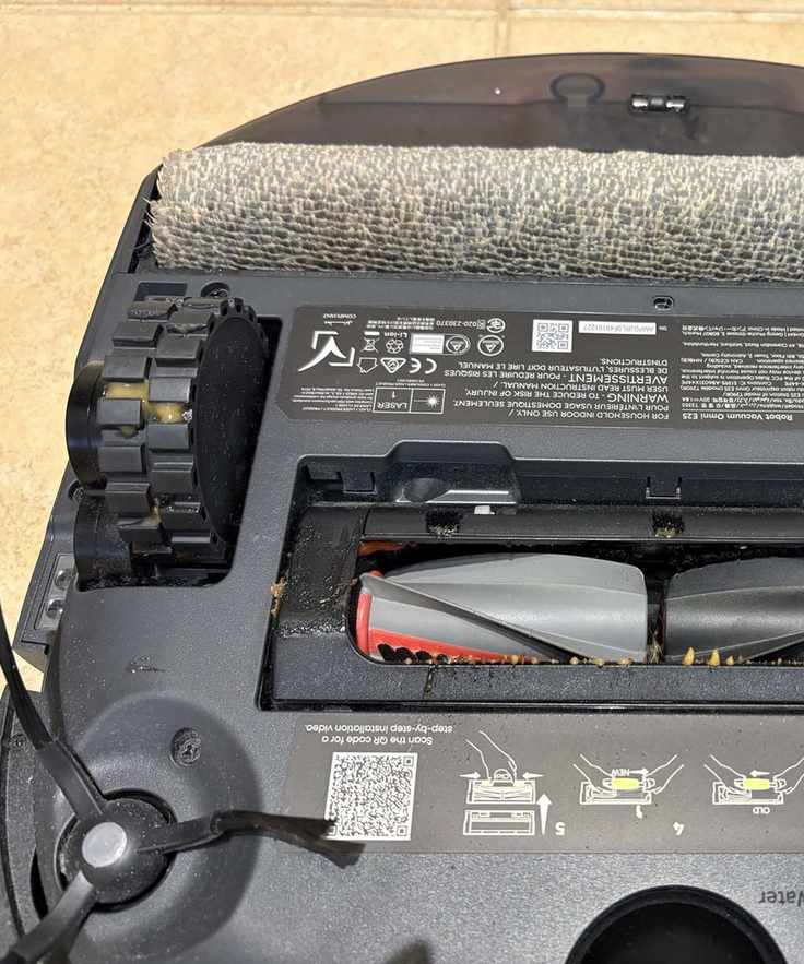 mustard and ketchup residue on the bottom of the eufy Omni E25 robot vacuum