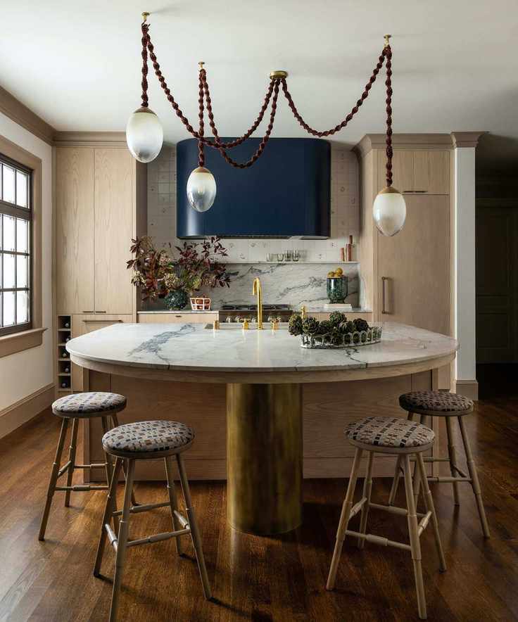 kitchen with curved island and four stools