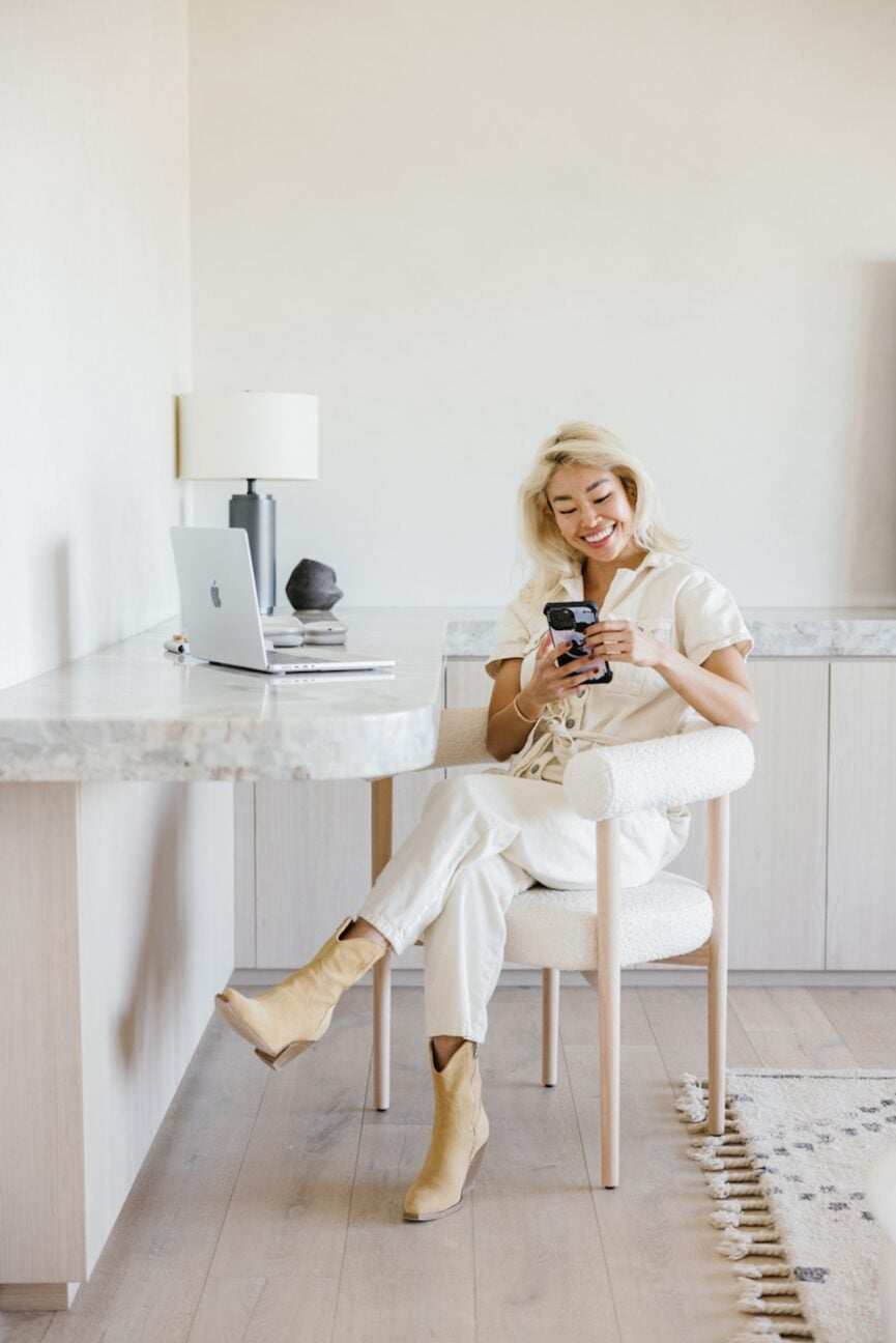 Woman practicing a personal curriculum on phone.