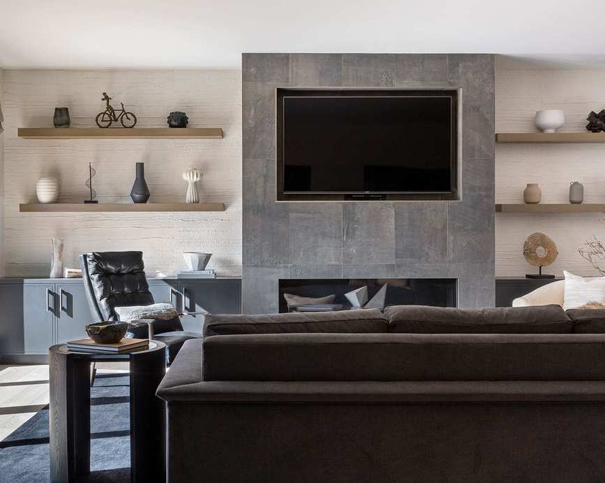 Living room with TV and grey wall and sofa
