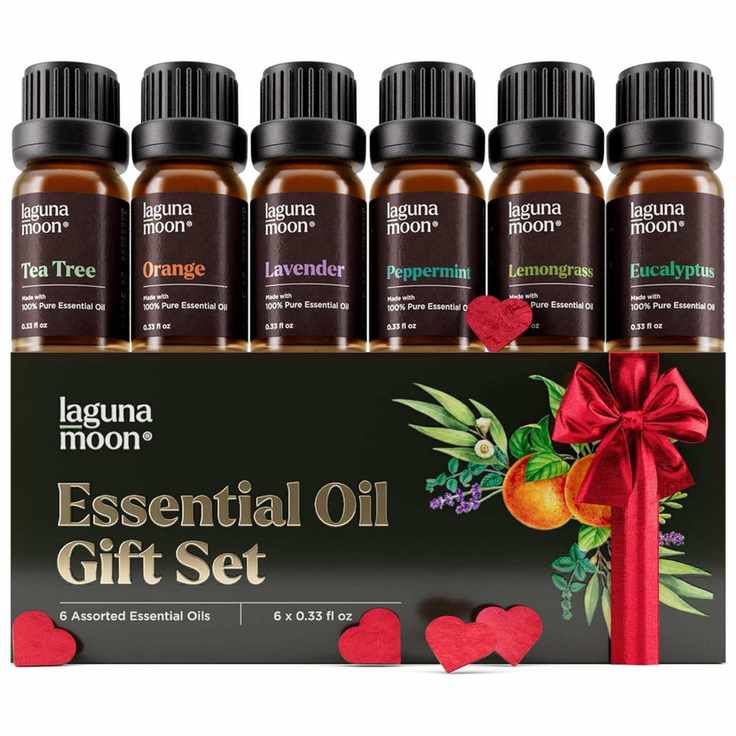 A set of small brown bottles of essential oils with black screw lids and a black cardboard packaging box