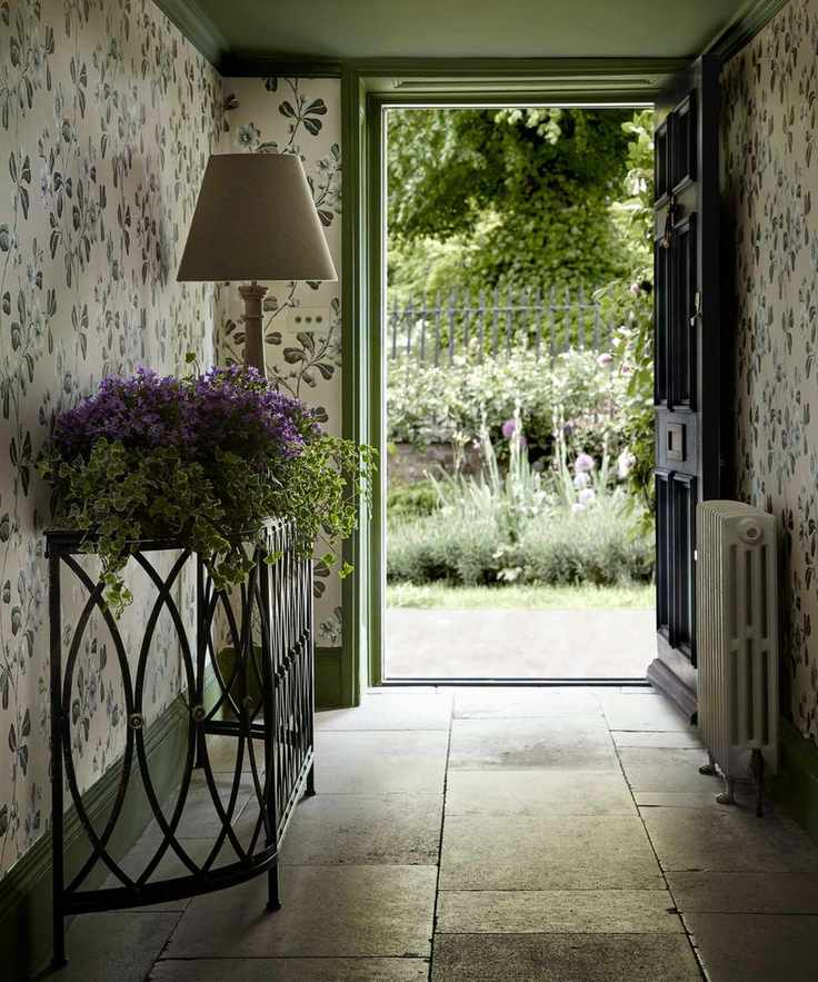 Entryway with floral wallpaper