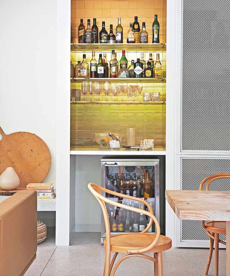 Home bar with tiled backsplash