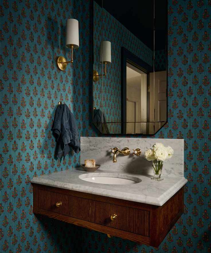 blue bathroom with floral wallpaper