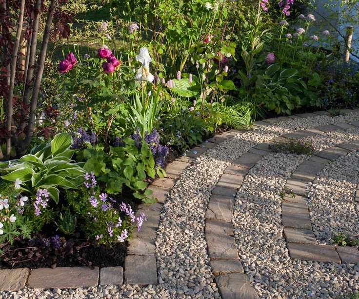 a gravel and brick paver circular patio