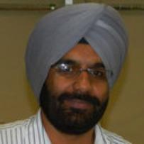 Headshot of Dr. Jaspreet Dhau in front of yellow wall.