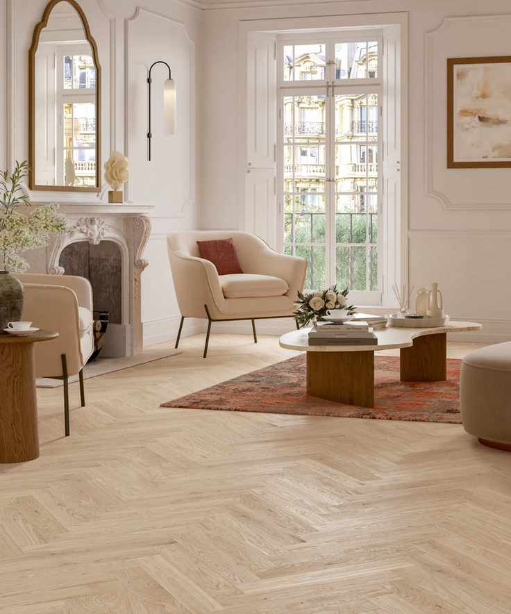 apartment living space with hardwood floor, herringbone layout, modern armchairs and couch, rug, coffee table, mirrors, Parador
