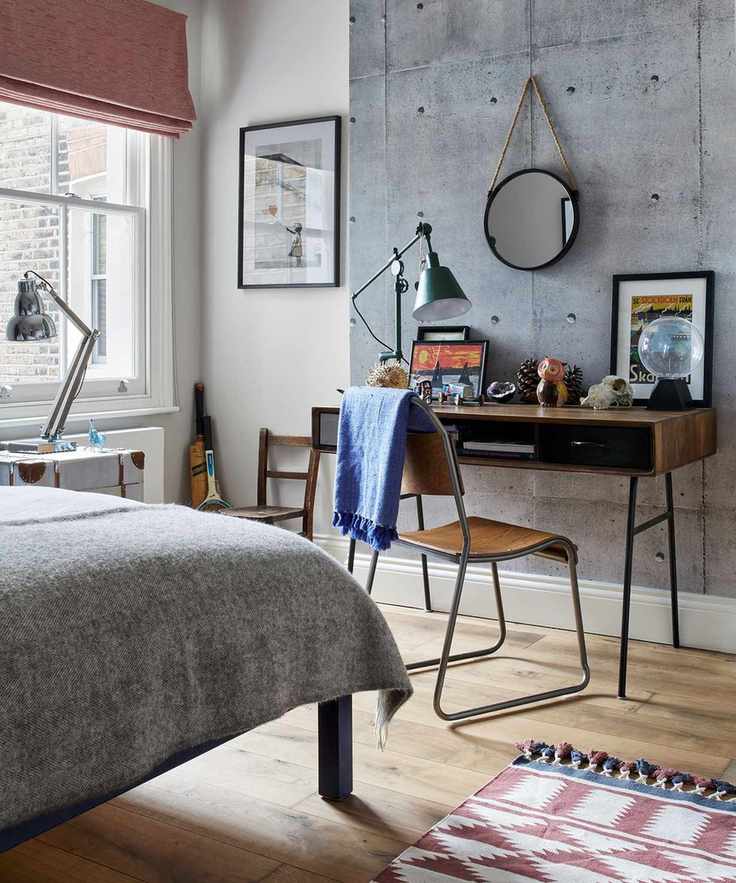 Sophisticated kids' room ideas in a neutral scheme with statement gray wall and midcentury desk.