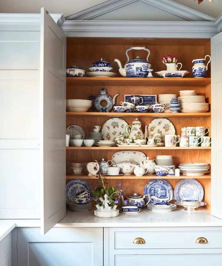 China collection in a kitchen cupboard, photograph Future Malcolm Menzies