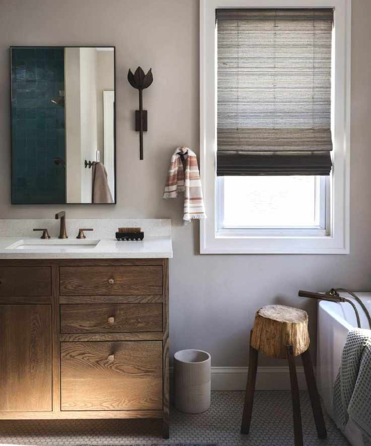 Beige bathroom with wall sconces