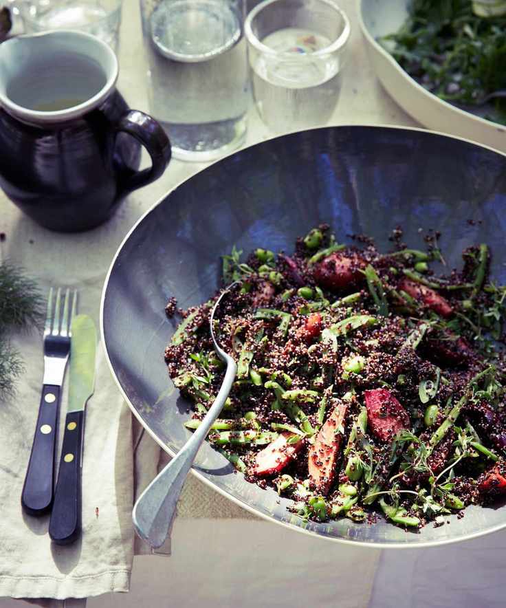 Black quinoa and beet salad presented in a grey bowl