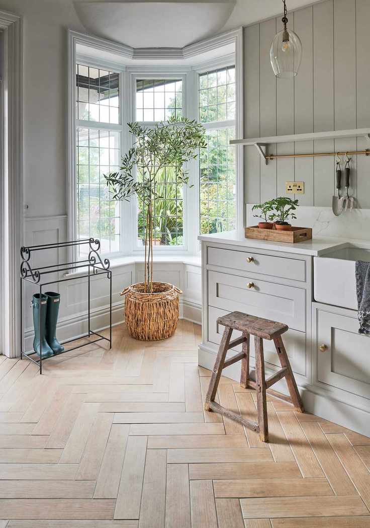 wood look tiles in kitchen with bay window