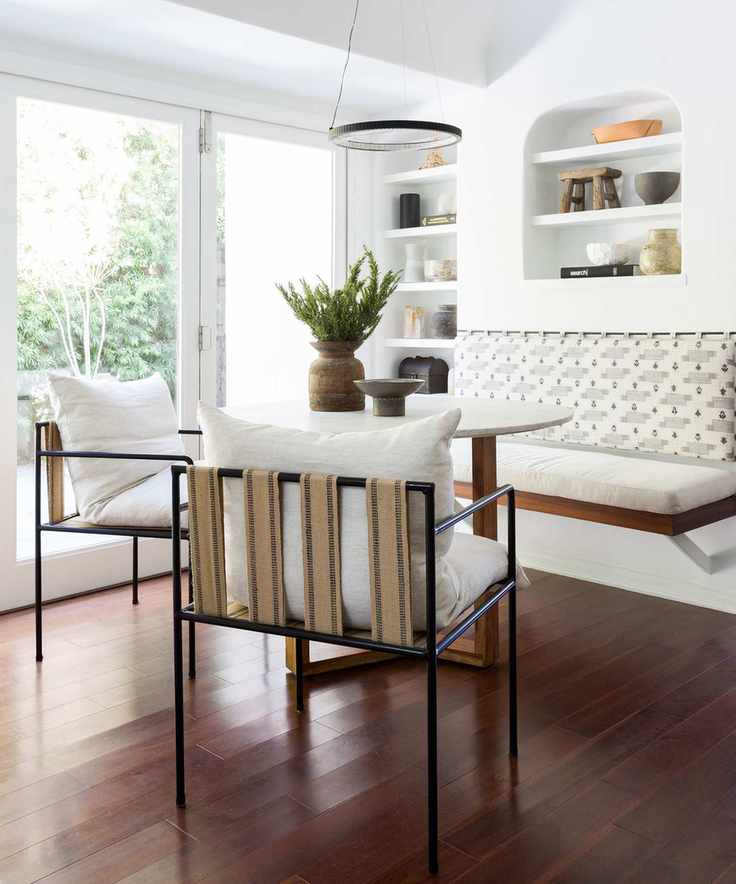 Bright dining room with dark wood flooring