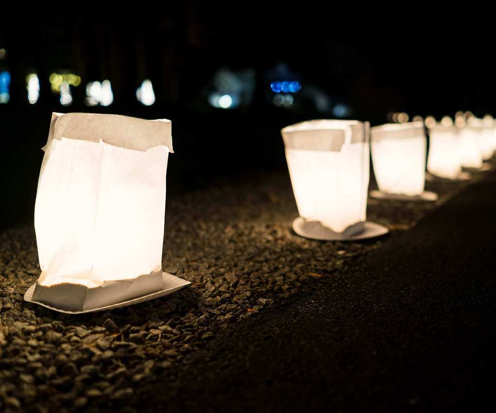 A path lit with candles and lanterns