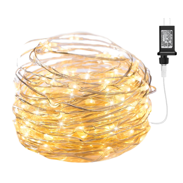 a bundle of ivory-gold string lights wrapped up in a neat coil next to their plug