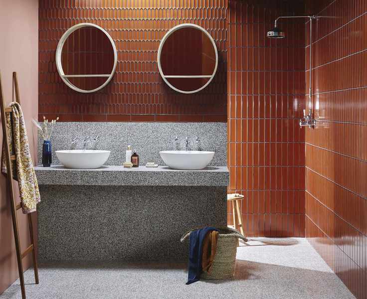Burnt orange tiles with different shapes and grey sink tiles
