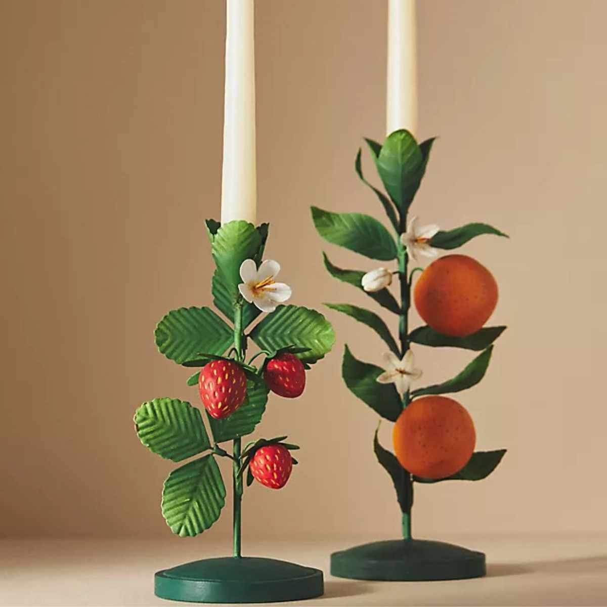 green metal candlesticks with strawberries and oranges