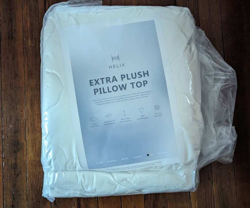 Helix Plush Mattress Topper on the floor.