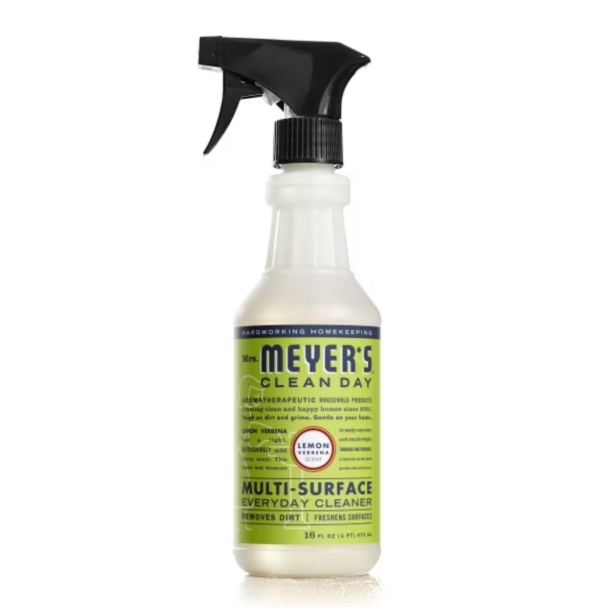 A clear bottle of cleaning spray with a green label and black lid