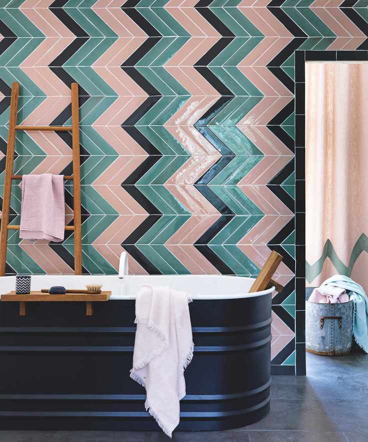 Bathroom with black, pink, and green chevron tiles