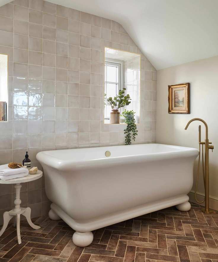 freestanding bathtub in a transitional bathroom