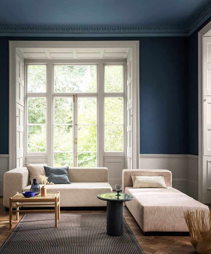 Blue living room with matching painted ceiling and trim