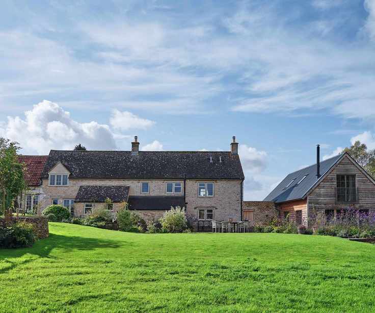 Exterior of the workers cottage and lawn. Joanne and Simon Binder's 19th Century Workers Cottage in Wiltshire.