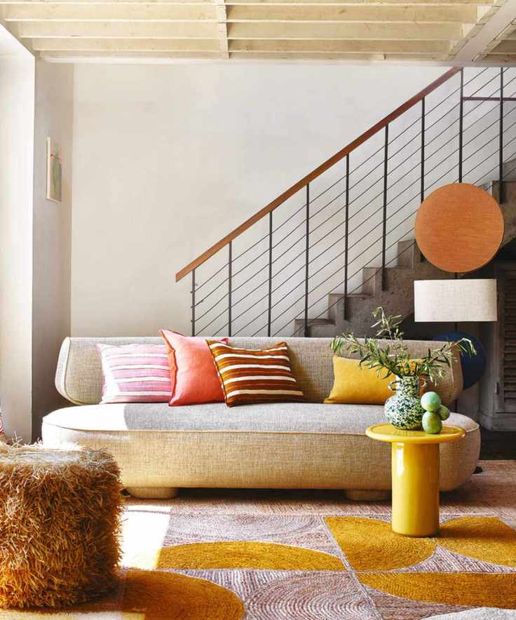 Colorful rug, stairs, sofa