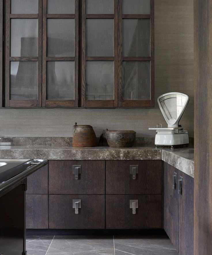 Dark kitchen cabinetry with smoky marble countertop