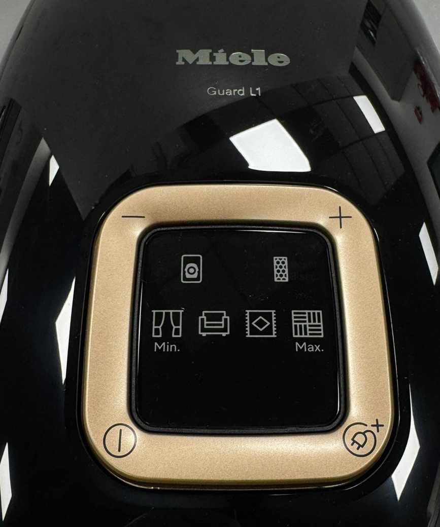 Closeup of the Miele Guard L1 Cat and Dog canister vacuum showing surface and controls.