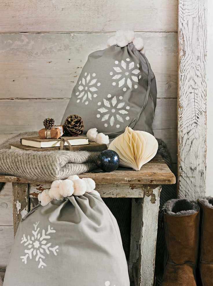 Grey fabric Christmas bags with stencilled snowflakes