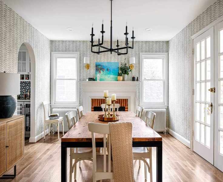 Dining room showcasing a wooden table and painted chairs