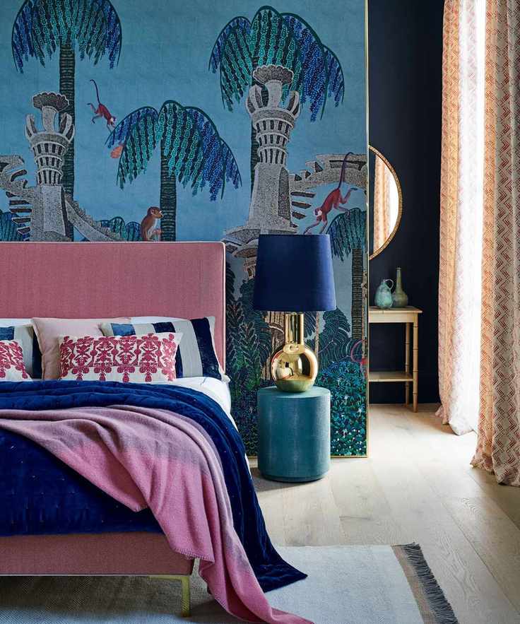 Mural in bedroom featuring palm trees on a blue background