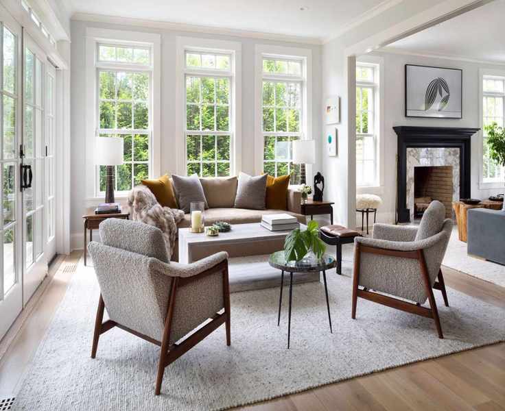 Cozy living room with cream sofa, cream rug and Scandi chairs in fleecy fabric