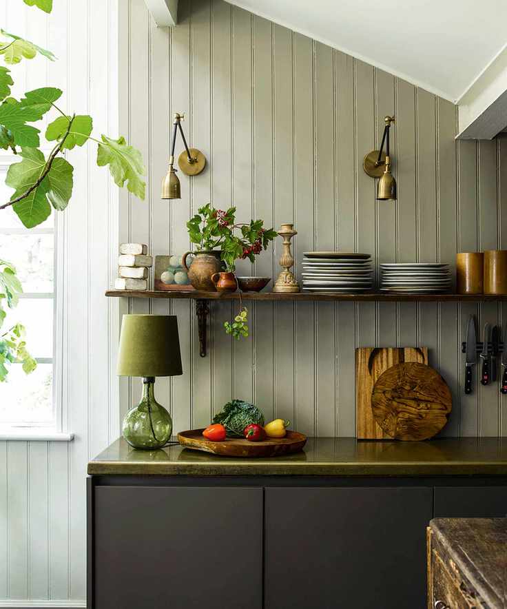 kitchen with open shelving and wall lights