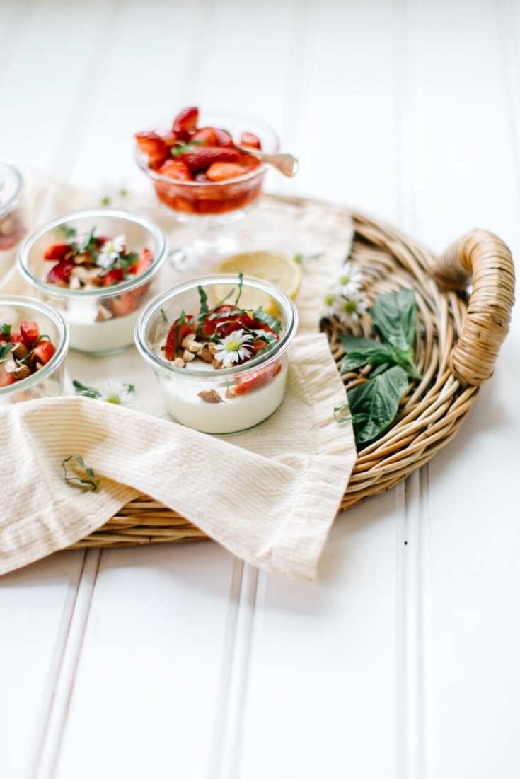vanilla panna cotta with strawberries on tray