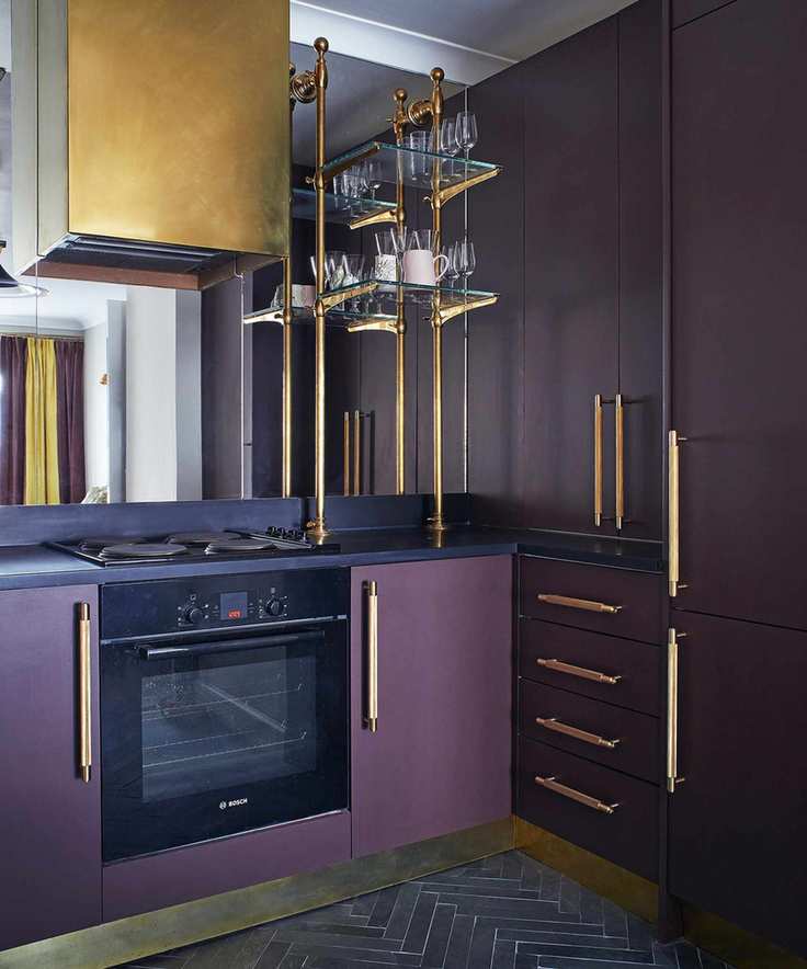Dark cabinetry with purple and gold accents