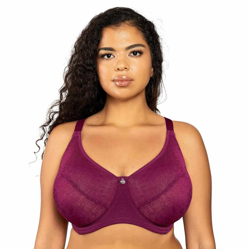 Woman wearing a purple bra on a white background
